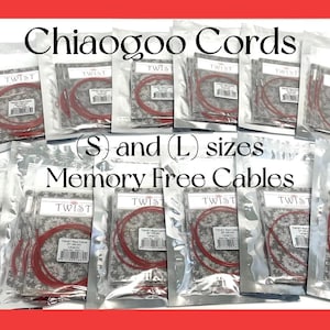 May include: A close-up of eight packages of red knitting needles. The packages are labeled "TWIST Red Cable" and are available in small and large sizes. The packages are labeled "Memory Free Cables".