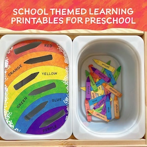 May include: A rainbow-colored printable learning activity for preschoolers. The printable features a rainbow with slots for crayons and the words "red", "orange", "yellow", "green", "blue", and "purple". A separate image shows a pile of crayons with the same color words written on them.