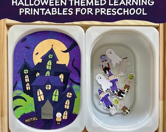 Può includere: Un'attività di apprendimento a tema Halloween per bambini in età prescolare. Una casa infestata viola e verde con una luna gialla e pipistrelli si trova a sinistra. A destra, un contenitore di plastica bianco contiene immagini ritagliate di personaggi di Halloween, tra cui un fantasma, una strega, un vampiro, una mummia e uno zombie. Il contenitore è etichettato "HOTEL".