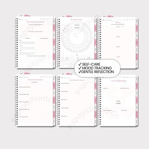 May include: A spiral-bound journal with pink tabs and accents, designed for self-care and reflection. It includes pages for mood tracking, gratitude, and self-love, with prompts and space for writing. Features include gentle reflection.
