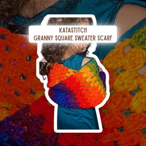 May include: A colorful granny square sweater scarf in a rainbow of hues, including red, orange, yellow, green, and purple. The scarf is handmade and features the text "KATASTITCH GRANNY SQUARE SWEATER SCARF". The scarf is draped over the shoulders.