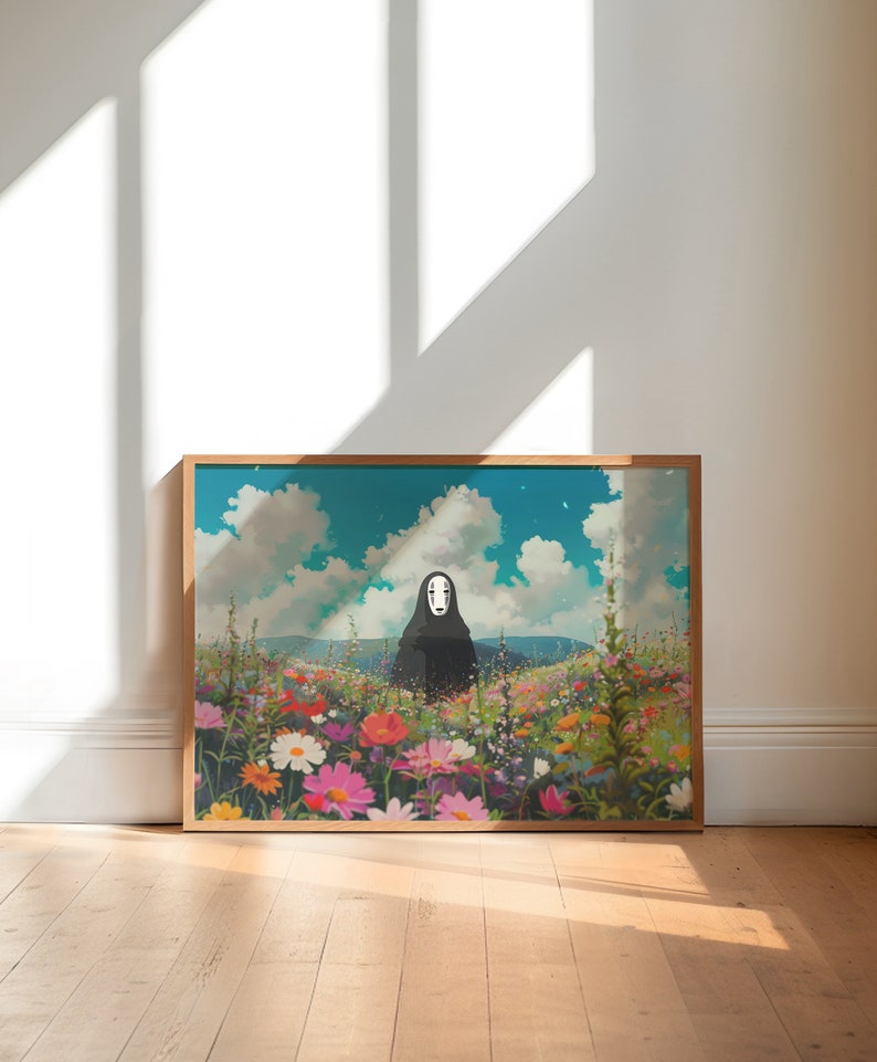 May include: A framed print of a black and white character with a blank face standing in a field of colorful flowers. The background is a blue sky with white clouds.