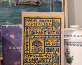 How to Survive Capitalism | Lino Print on Hand-painted Watercolour Recycled Card