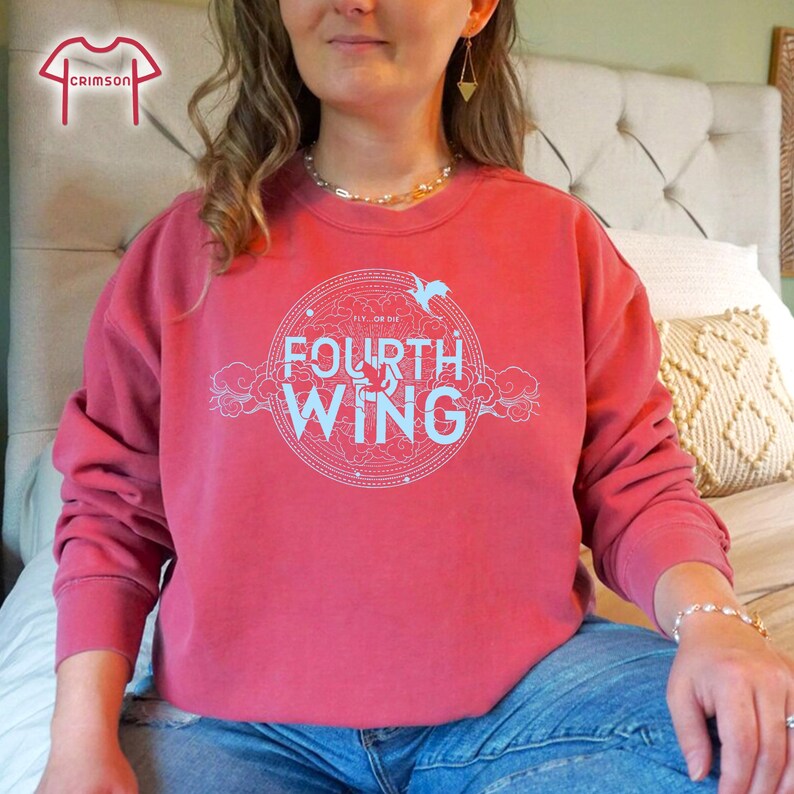 May include: A crimson red sweatshirt with a white graphic design that says "Fly or Die" and "Fourth Wing".
