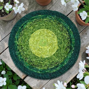 May include: A set of three ceramic mugs with a speckled, matte finish. The mugs are in shades of cream, light gray, and dark gray. Each mug has a simple, minimalist design, perfect for coffee or tea.