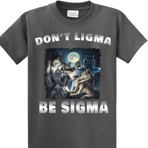 May include: A dark gray t-shirt with a silver graphic print of wolves howling at the moon. The text "DON'T LIGMA BE SIGMA" is printed in silver on the shirt.