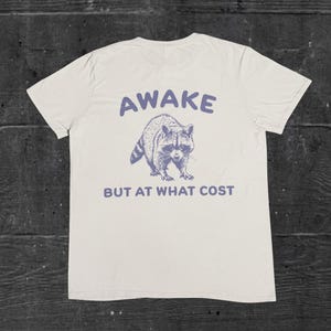 Awake but at what cost, silly raccoon t-shirt, meme shirt, funny graphic tee, funny shirt gift, racoon graphic t-shirt, retro design t-shirt