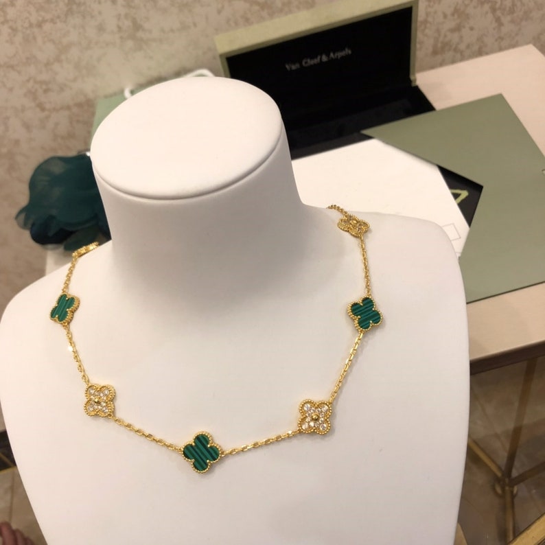 Stunning 18k gold necklace, featuring a four-leaf clover adorned with  genuine diamonds and a small