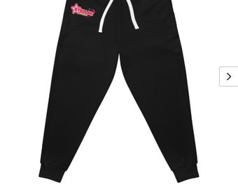 Può includere: Pantaloni della tuta neri con un logo rosa e bianco che dice "STELLAR" con una stella.