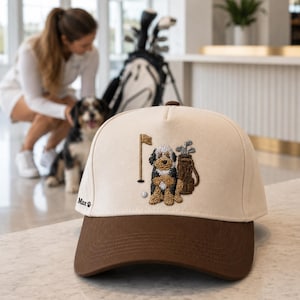 An embroidered "GOLF DOG" golf hat resting on a wooden surface, showcasing high-quality stitching and a classic unstructured design. This versatile cap serves as a perfect dog golf lover gift for birthdays or golf tournaments. Ideal for protecting your eyes from the sun on the green, this golf hat is a unique accessory that combines a passion for the sport with a love for dogs, ensuring you look great while playing.