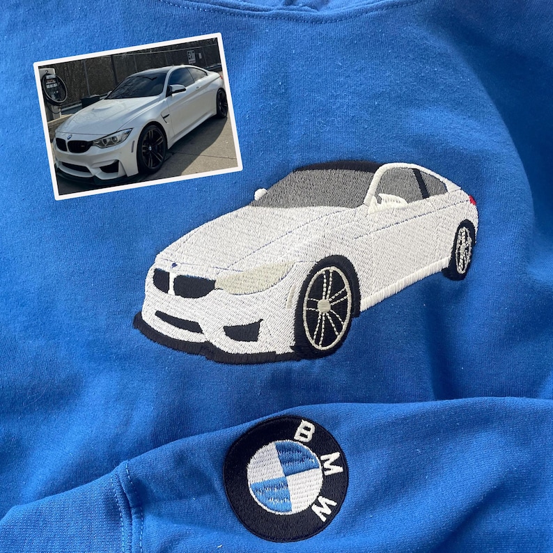 Royal embroidered sweatshirt featuring custom white BMW car embroidery inspired by owner’s photo, with BMW logo patch on sleeve. Unique personalized car sweatshirt for BMW fans and car enthusiasts.