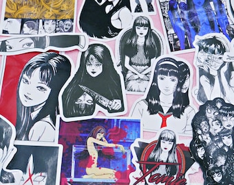 May include: A collection of manga-style stickers featuring various black and white illustrations of female characters with long hair and dark eyes. Some stickers have Japanese text and bold graphic designs.