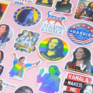May include: A collection of colourful stickers featuring Kamala Harris, the 49th Vice President of the United States. The stickers feature various designs, including portraits, slogans, and patriotic imagery. The text on the stickers includes "Kamala Harris", "2024", "Freedom", "Cat Ladies for Kamala", "I'm Speaking", "Madam Vice President", and "Kamala Makes Me".