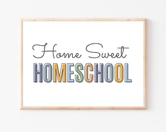 May include: A framed print with the text "Home Sweet HOMESCHOOL" in colorful letters. The letters are outlined in black and have a slight shadow effect. The background is white.