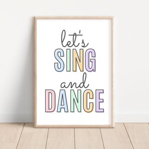 May include: A printable wall art design with the text "let's sing and dance" in colorful letters. The letters are outlined in black and have a pastel color scheme.