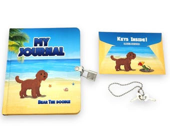 May include: A blue and yellow journal with a beach scene and a brown dog on the cover. The journal has a lock and key and says "My Journal" and "Bear the Doodle" on the cover. The journal comes with a separate card that says "Keys Inside!" and a key chain with two keys.