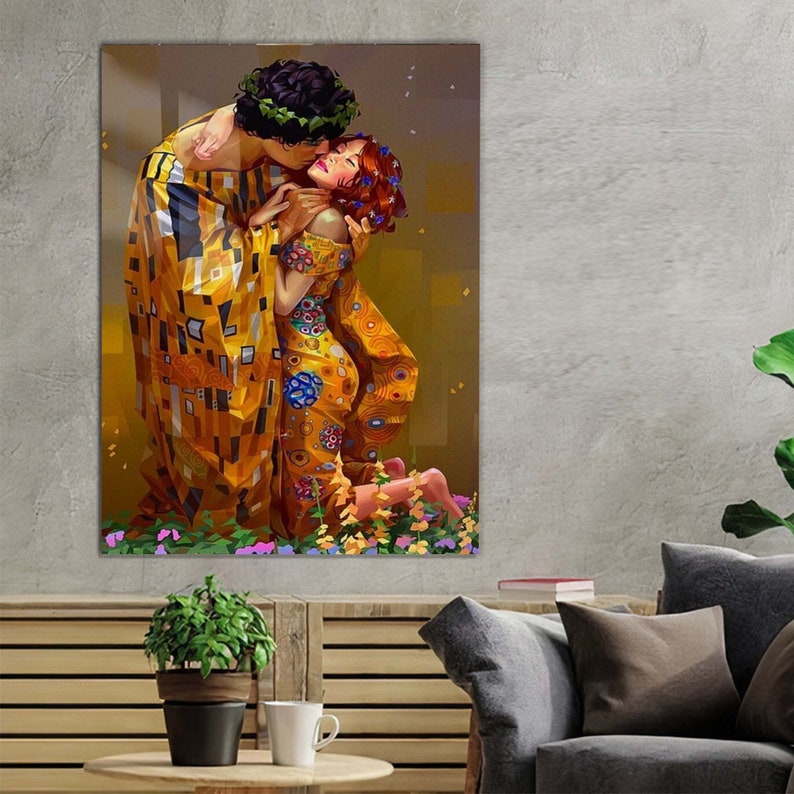 May include: A painting of a couple embracing, the man in a yellow and black patterned robe and the woman in a yellow and blue patterned dress. The painting is set against a background of flowers.