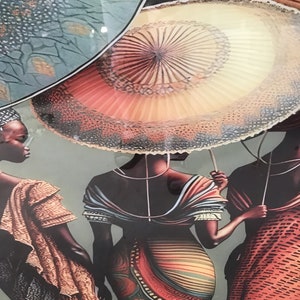 May include: Three women wearing colourful patterned dresses and holding large, colourful umbrellas. The umbrellas have a circular design with a central point and radiating lines.