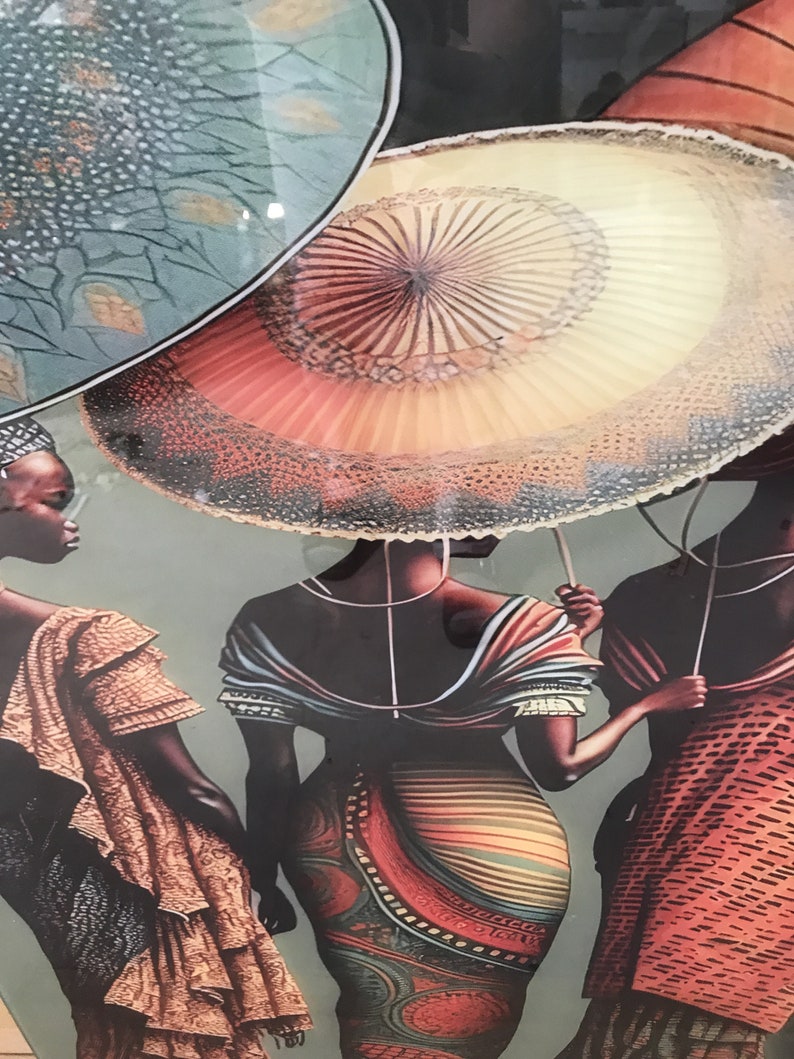 May include: Three women wearing colourful patterned dresses and holding large, colourful umbrellas. The umbrellas have a circular design with a central point and radiating lines.