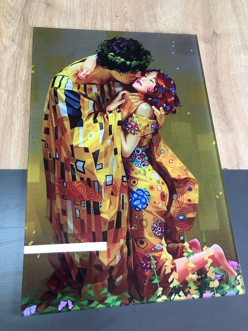 May include: A painting depicting a couple embracing in a colourful, abstract style. The man is wearing a yellow and brown patterned robe, and the woman is wearing a yellow and red patterned dress. The painting is set against a green background.