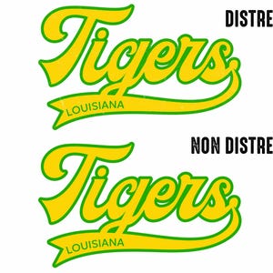 May include: A graphic design featuring the word "Tigers" in a stylized, yellow script with a green outline. Below the word is a banner that reads "Louisiana" in green. The design is presented in both distressed and non-distressed versions.