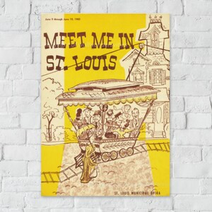 May include: Vintage poster with yellow and tan tones. The text reads "Meet Me In St. Louis" with "June 9 through June 19, 1960" above. A trolley car with passengers is depicted, along with a woman in a long dress. "St. Louis Municipal Opera" is at the bottom.