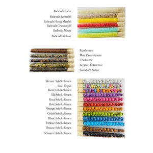 May include: Assortment of small glass test tubes filled with various bath salts, teas, and chocolate sprinkles. The bath salts are labeled with different scents, including lavender, honey, and pomegranate. The teas are labeled with names like Rooibos, Mate, and Fruit. The chocolate sprinkles are labeled with different colors, including white, pink, and orange.