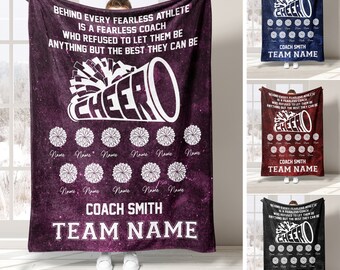 May include: Purple and white cheerleading blanket with the text "Behind every fearless athlete is a fearless coach who refused to let them be anything but the best they can be."  The blanket also features a cheerleader megaphone with the word "cheer" and a space-like background.  The blanket has space for names of cheerleaders.