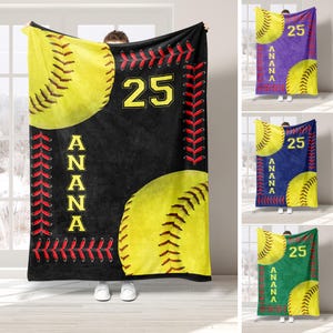 May include: Soft black fleece blanket with a yellow softball design, red stitching, and the text "25 ANNA" in yellow.