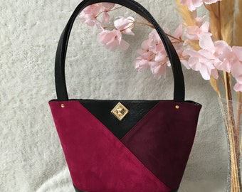 Bolso de piel sintética y ante rosa y negro