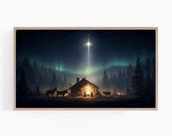 May include: A framed print depicts a serene winter scene with a cabin illuminated by warm light. A bright star shines above, with the aurora borealis in the background. Silhouetted horses and cattle stand near the cabin, with a campfire in the distance.