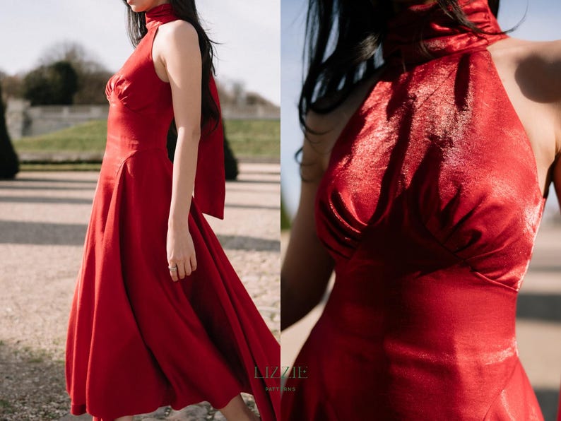 May include: A striking red dress with a high neck and a flowing skirt. The dress has a halter-style top and a bow detail at the back. The dress is made of a shiny fabric, suitable for formal events.
