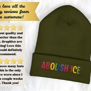 May include: Olive green beanie with the embroidered text "ABOLISH ICE" in rainbow colors. The hat is folded at the brim. The image also includes customer reviews with text and star ratings.