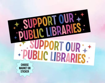 May include: Two rectangular magnets or stickers with the text "SUPPORT OUR PUBLIC LIBRARIES" in colorful letters. One is on a black background, the other on white. Both have star accents and a light blue, pink, and purple background.