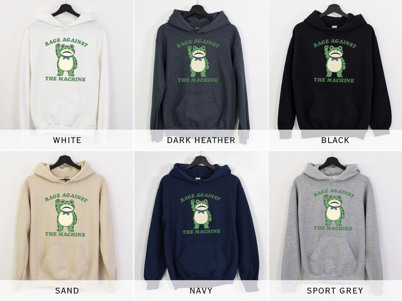 May include: A collection of hooded sweatshirts in various colors, including white, dark heather, black, sand, navy, and sport grey. Each sweatshirt features a green frog graphic with the text "RAGE AGAINST THE MACHINE".