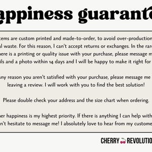 May include: Cream-colored card with the words "happiness guarantee" in a bold, black, whimsical font. Text within a rounded rectangle details the shop's policies, with a small gray heart in the lower left corner and the shop name at the bottom.