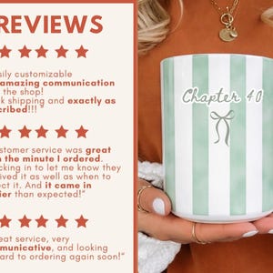 May include: A white ceramic mug with vertical light green stripes. The mug has a black handle and features the text "Chapter 40" with a bow graphic. The image also includes customer reviews.