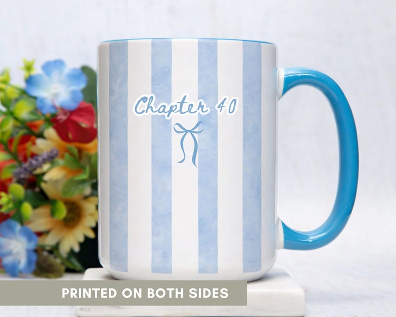 May include: A white ceramic mug with blue vertical stripes and a blue handle. The mug has the text "Chapter 40" with a bow graphic. The words "PRINTED ON BOTH SIDES" are at the bottom of the mug.