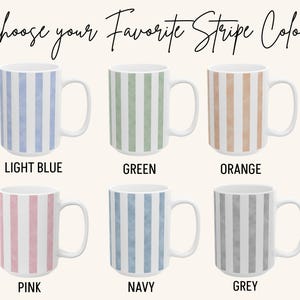May include: White ceramic mugs with vertical stripe patterns in light blue, green, orange, pink, navy, and grey. The text "Choose your Favorite Stripe Color" is at the top, with color names below each mug.