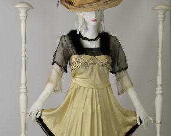 Antique Dress from Yellow Muslin, 1913, Ukraine. The slouchy bodice trimmed with pieced lace. Lace embroidery is made with pink/blue beads.