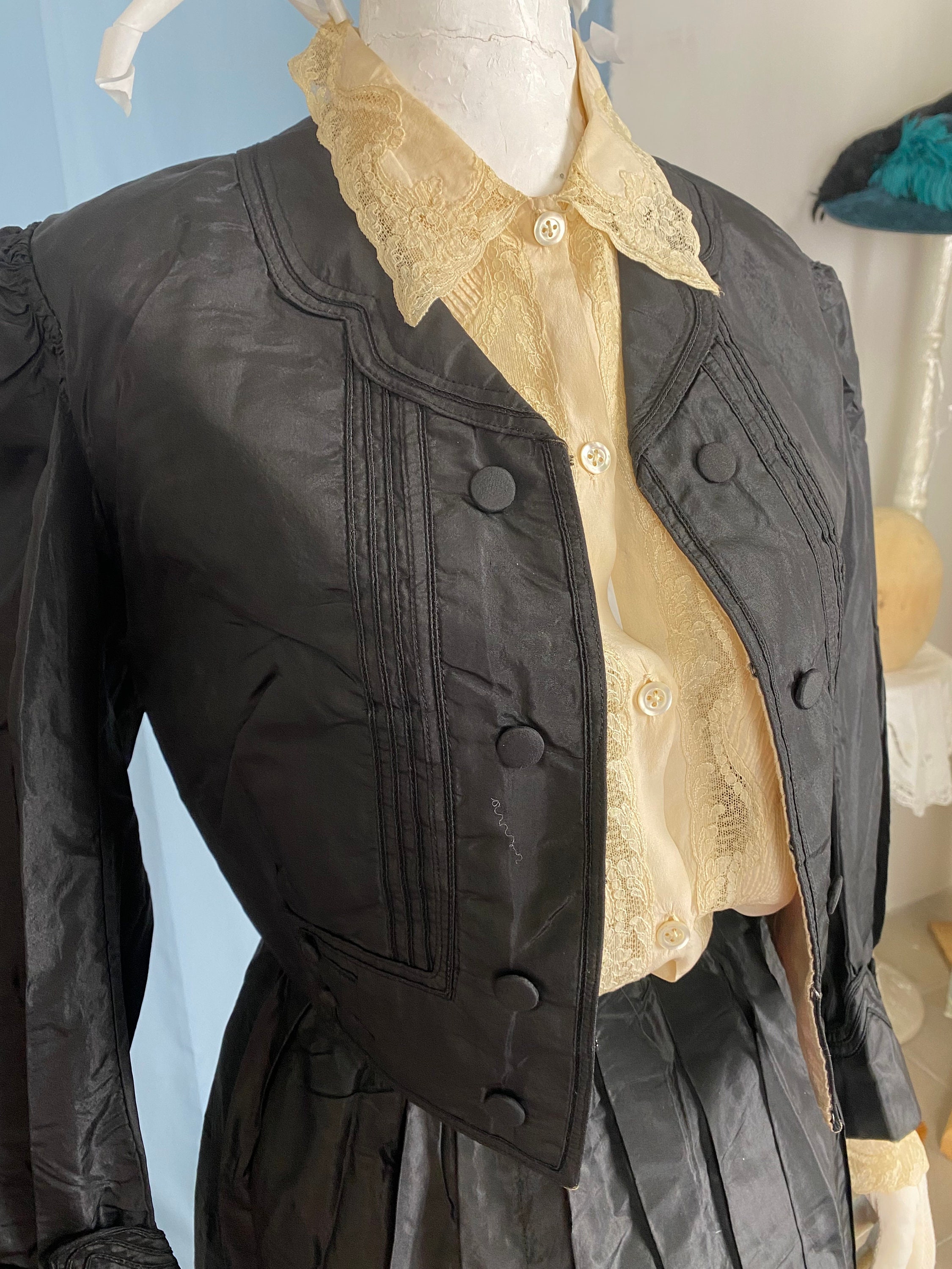 Vintage Women's Suit 1900-1910. Europe. Modern. Black silk fabric. The jacket is short with a very beautiful finish, buttons.