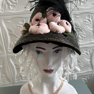 antique hat 1880.  Spain. interesting shape “boat” Natural black straw decorated with pink flowers stuffed with cotton wool. a bunch of blac