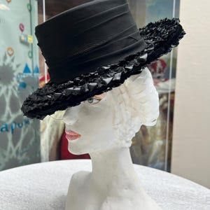 1950, Russia.Circa 1950-1955. Women's hat from Russia for city walks. A very interesting brimless shape with a large brooch on the side.(3)