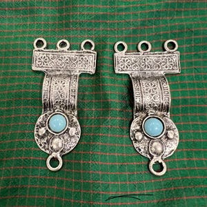 antique buckle. 1900-1920. Or 2 beautiful metal cast parts. fly metal. blue stones. length of two 14 cm. possibly for a belt or other purpos