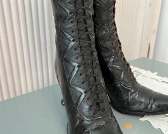 Antique women's shoes, circa 1900. USA. High-heeled women's boots. High-quality, genuine black leather. Lace-up front closure. Elegant and f