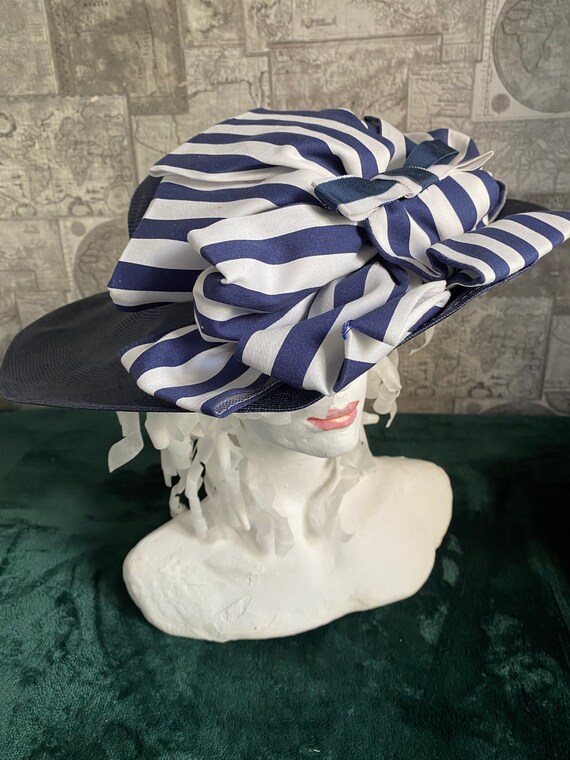 Vintage Hat, 1960, Europe. Blue straw with large bows made of striped fabric: White and blue stripe. Good for 50