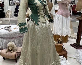 Antique women's business suit 1860-1870. Europe. Beautiful bodice with a peplum made of 2 in taffita light green and emerald green. Cut at t