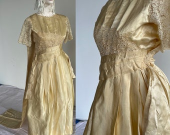 Antique Wedding Dress, 1912, Europe. Material is a stunning silk satin piece. The dress is decorated with a beautiful Watteau style train.