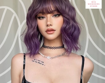 May include: A woman with purple wavy hair and bangs. She is wearing a black choker and a silver necklace. The image includes the text "Wig Wonders Store". There is a tattoo on her left shoulder that says "Am I that girl that you dream of?"