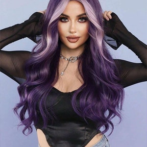 May include: A long, wavy wig with a dark purple base and light purple highlights. The wig is styled with a center part and falls to the shoulders. The person in the image is wearing a black top and blue jeans.